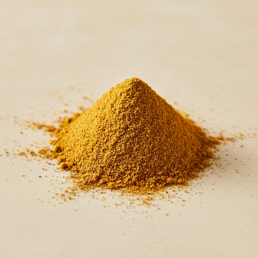 Golden organic curry powder with warm ochre color and fine ground texture